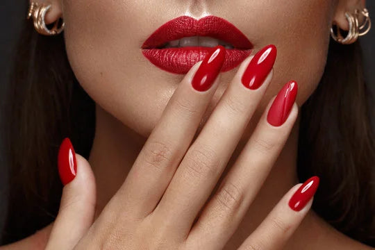 woman with red lipstick and red nails